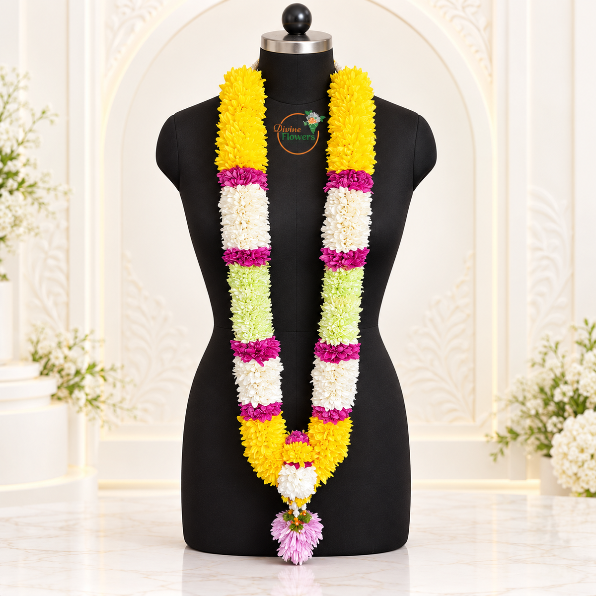 Mums Chamanti wedding garland WG-MGR-002 with pink tassel on a black mannequin with Divine Flowers branding